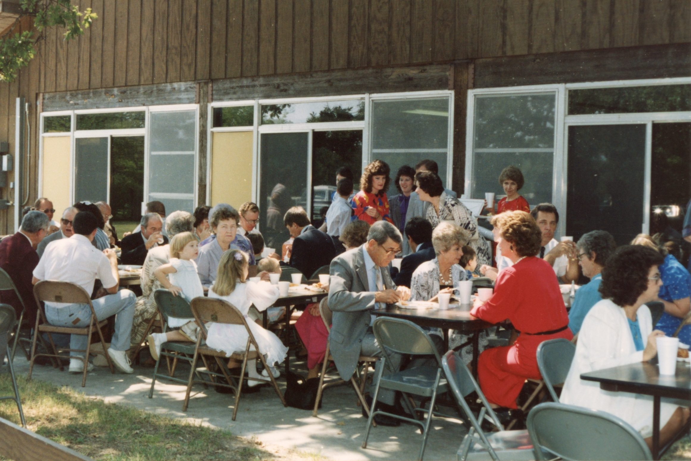 Church fellowship being held outside.